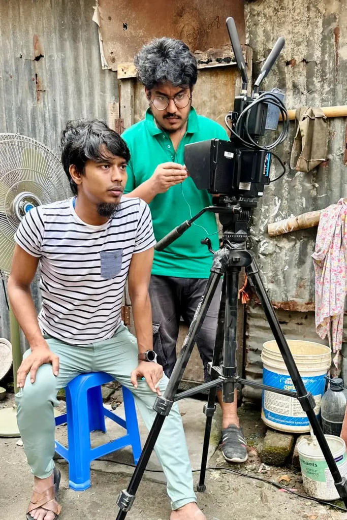 Faisal Khan Shuvo reviewing the camera setup during a location shoot