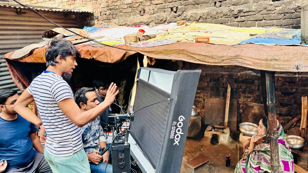 Faisal Khan Shuvo directing an outdoor scene during Apon Hoyeo Por production
